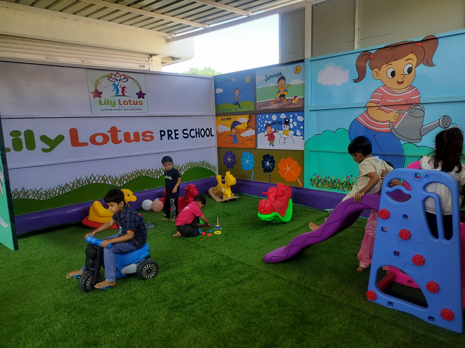 Nursery students playing in the outdoor play area at Lily Lotus Preschool Becharaji